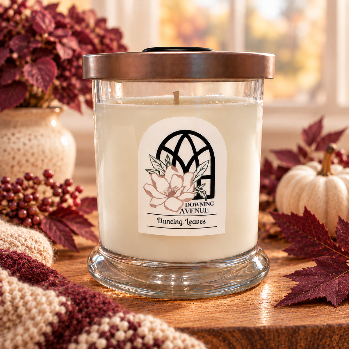 Dancing Leaves hand-poured candle by Downing Avenue, copper lid