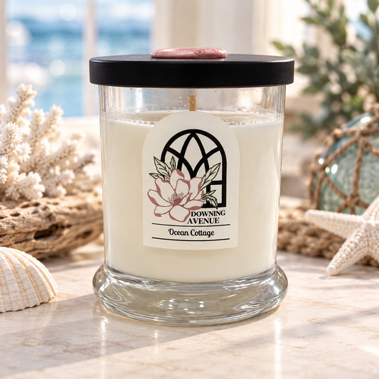 Ocean Cottage hand-poured candle by Downing Avenue, black lid with pink wax seal
