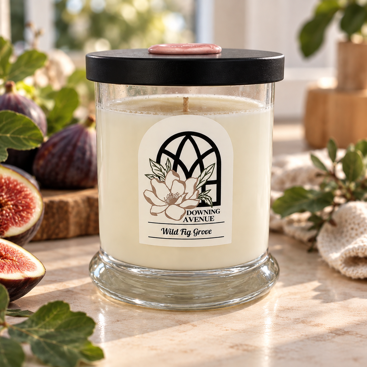 Wild Fig Grove hand-poured candle by Downing Avenue, black lid with pink wax seal